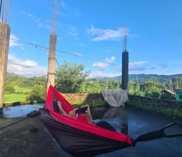 Cheesang relaxing in Langtang Gear hammock outdoors Nepal