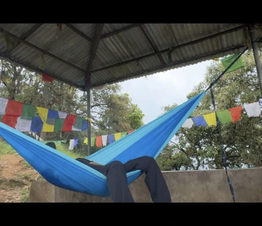 Customer relaxing in Langtang Gear hammock Nepal adventure