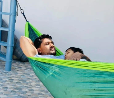 Sanjay relaxing in Langtang Gear hammock setup Nepal