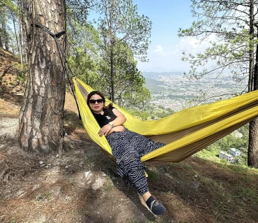 Sara Yonjan relaxing in Langtang Gear hammock outdoors