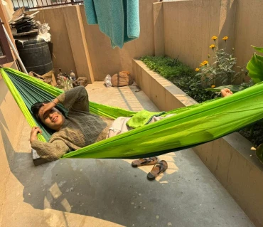 Shadev 2 relaxing in Langtang Gear hammock outdoors